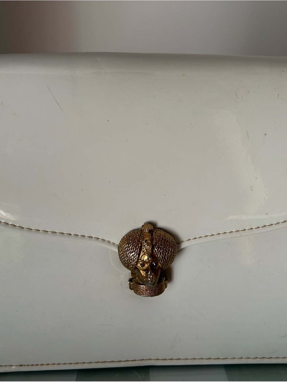 White Patent Clutch with Gold Elephant Accent